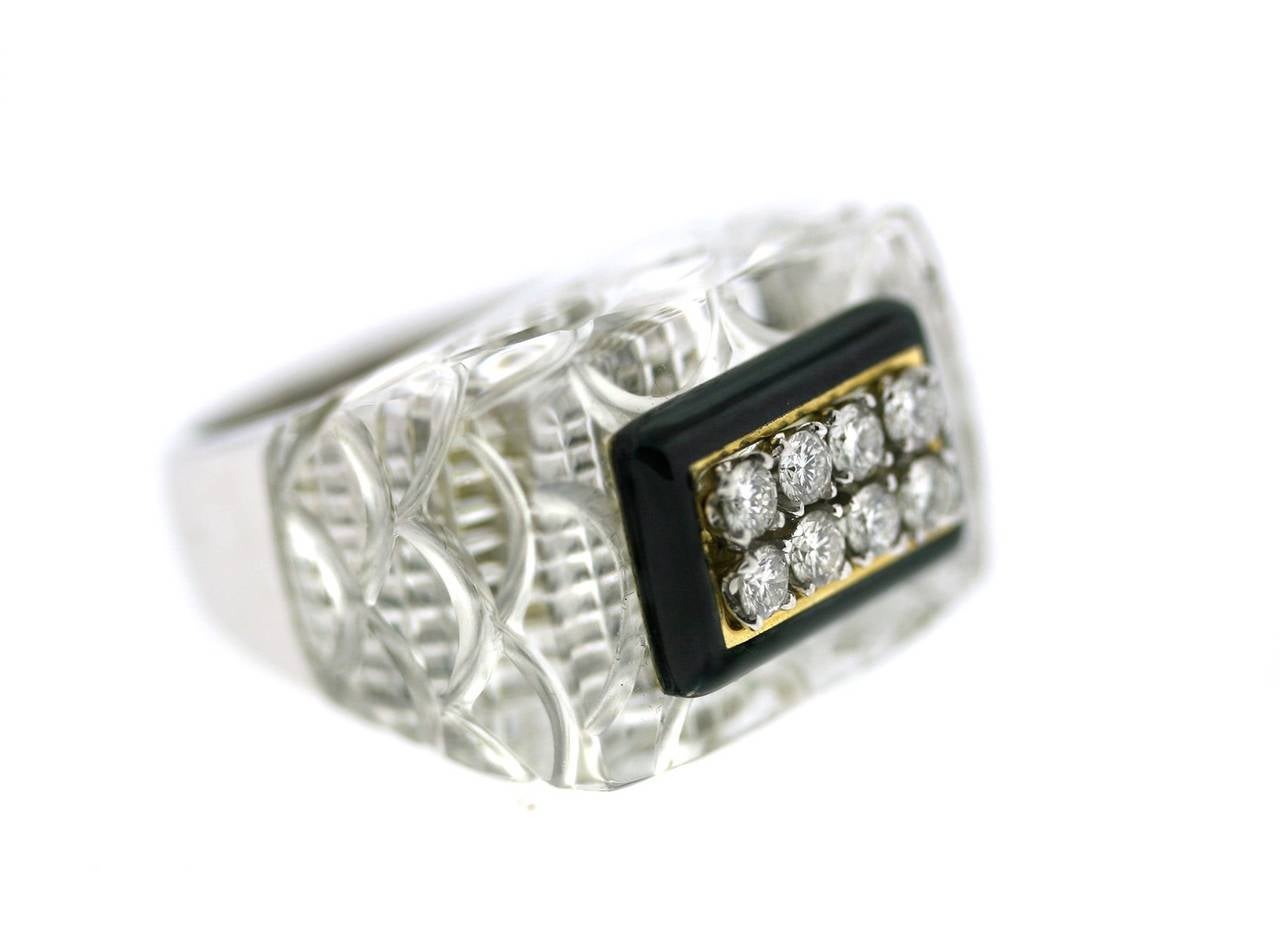 Fabulous platinum and 18k gold David Webb ring set with carved rock crystal centering a black enamel, rectangular, diamond set section. Approximate size 6. Can be resized. Signed Webb, Circa 1970s
