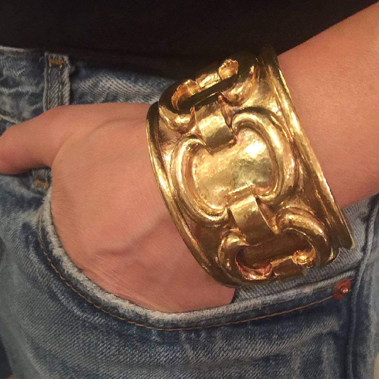 David Webb 18k hammered gold hinged cuff bracelet with a chain link design in relief. 1.75