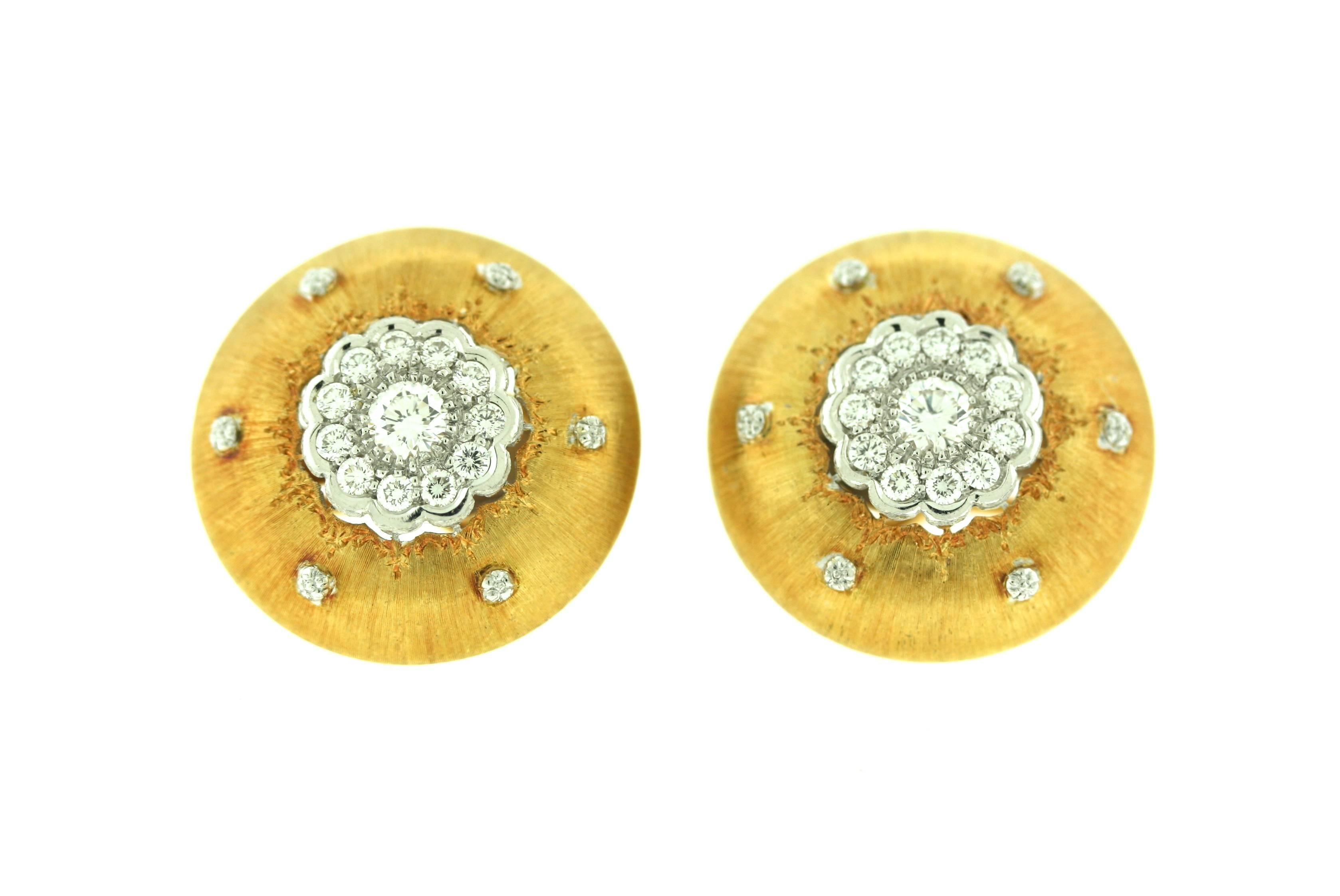 Buccellati 18k gold hand tooled and engraved large button earrings with diamond center medallions of a floral motif surrounded by six smaller diamond accents. Signed Buccellati with maker's mark and gold mark. 

