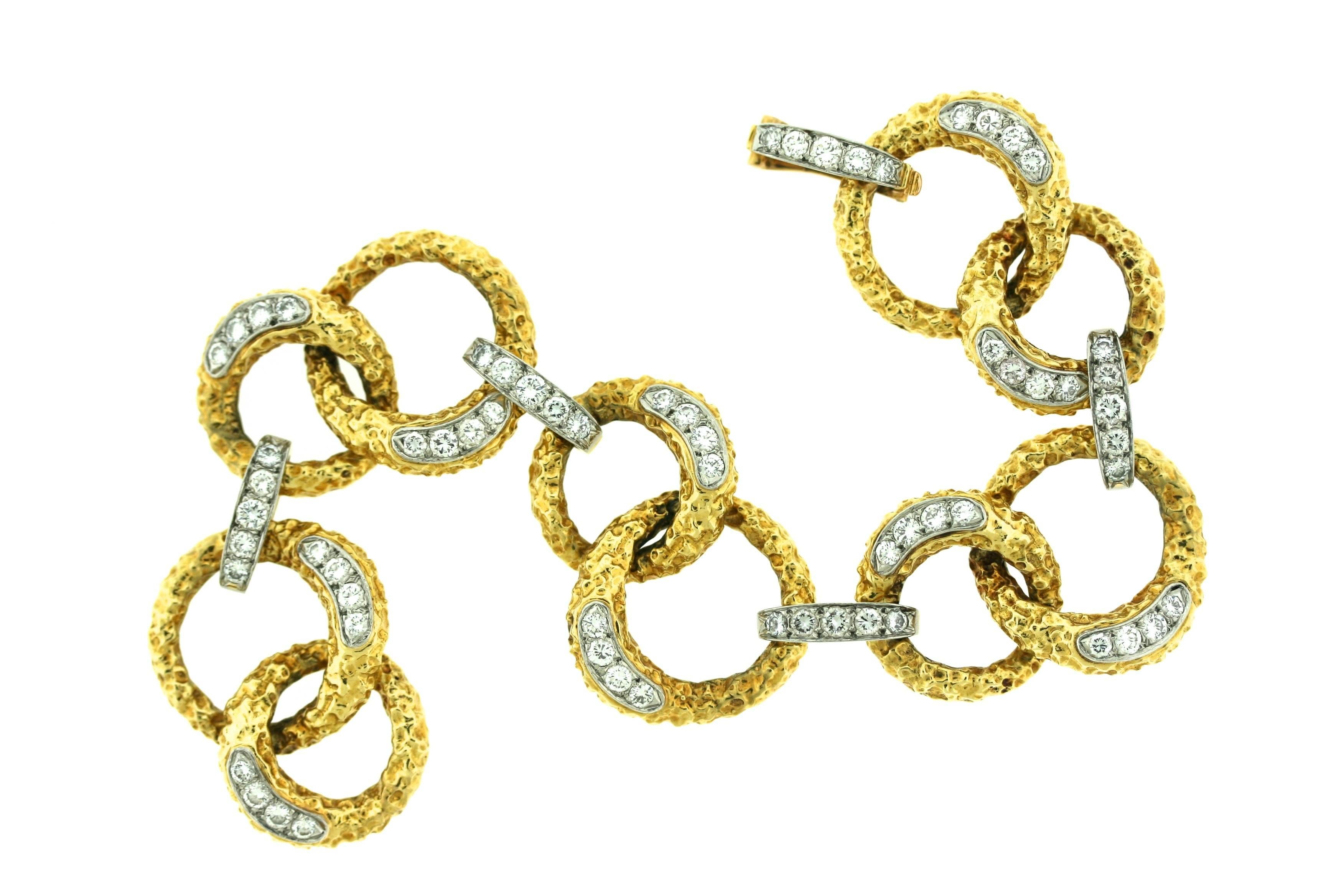 M Gerard 18k textured gold and diamond bracelet designed as circular pairs of links alternating with diamond set horizontal links. A total of 65 diamonds weigh approximately four carats. 8