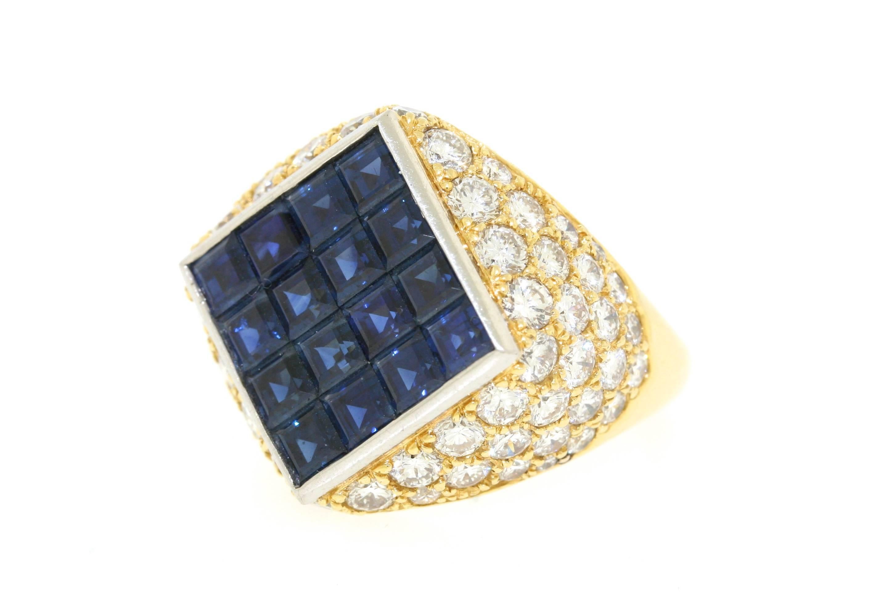 Van Cleef & Arpels 18k gold and platinum ring of a bombe design centering a square top with 16 mystery-set calibre-cut sapphires in a surround of pave-set diamonds. Size 6. Signed VCA NY 52889. Circa 1982