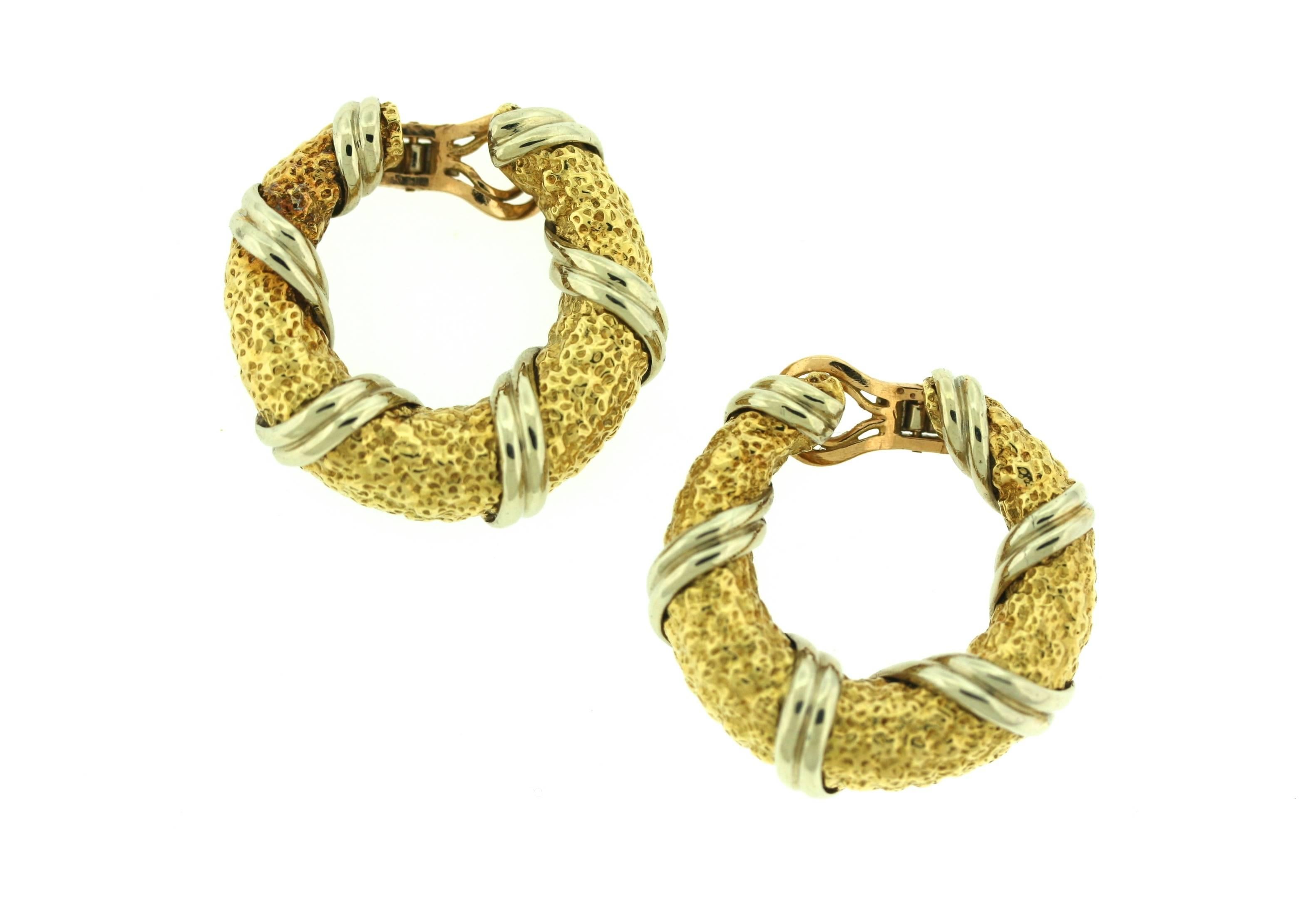 Van Cleef & Arpels textured 18k yellow gold hoop earrings wrapped in ribbons of polished white gold. 1 3/8
