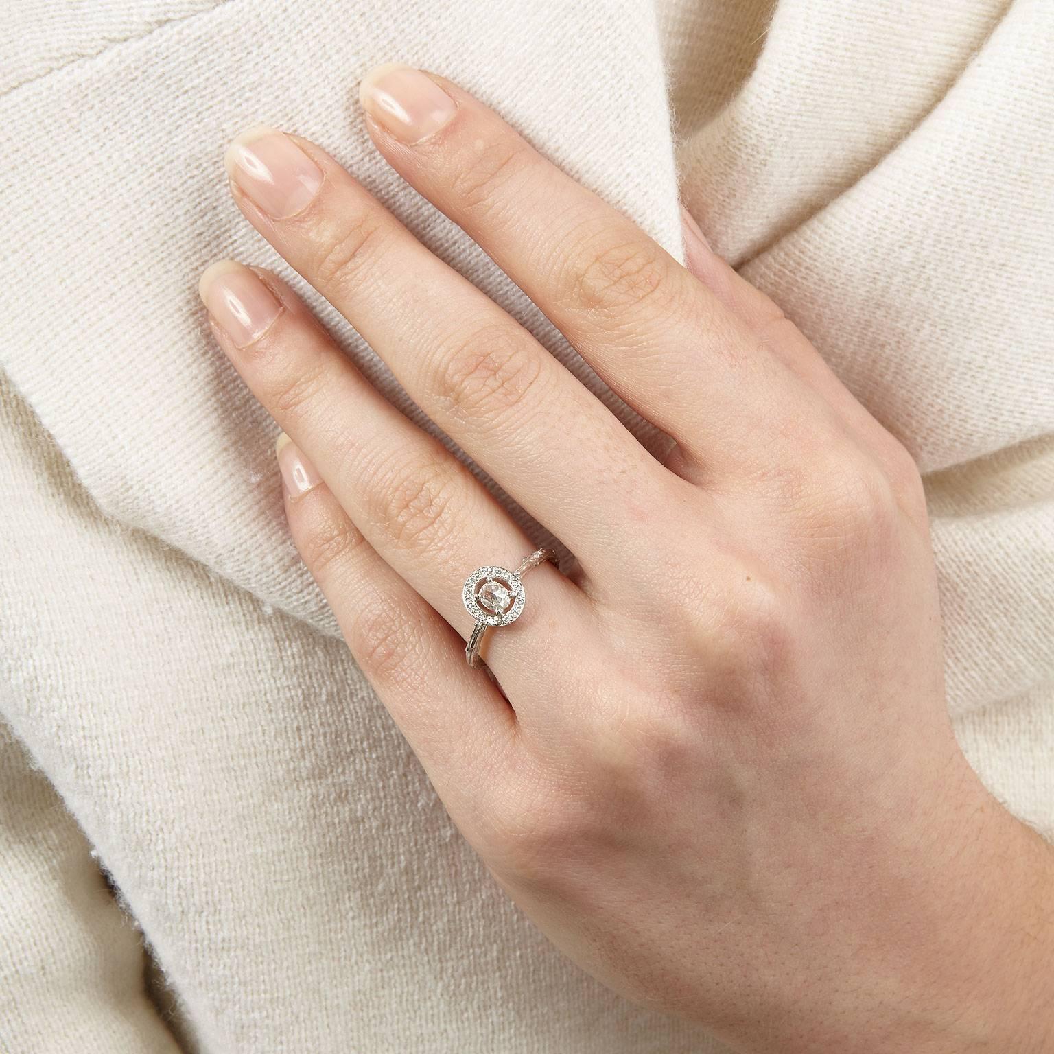 The Titania ring features a beautiful oval rose cut diamond surrounded by a halo of small round brilliants. Mixing a traditional style setting with a textured twig band for a contemporary twist.
This is one seriously sparkly ring - perfect if