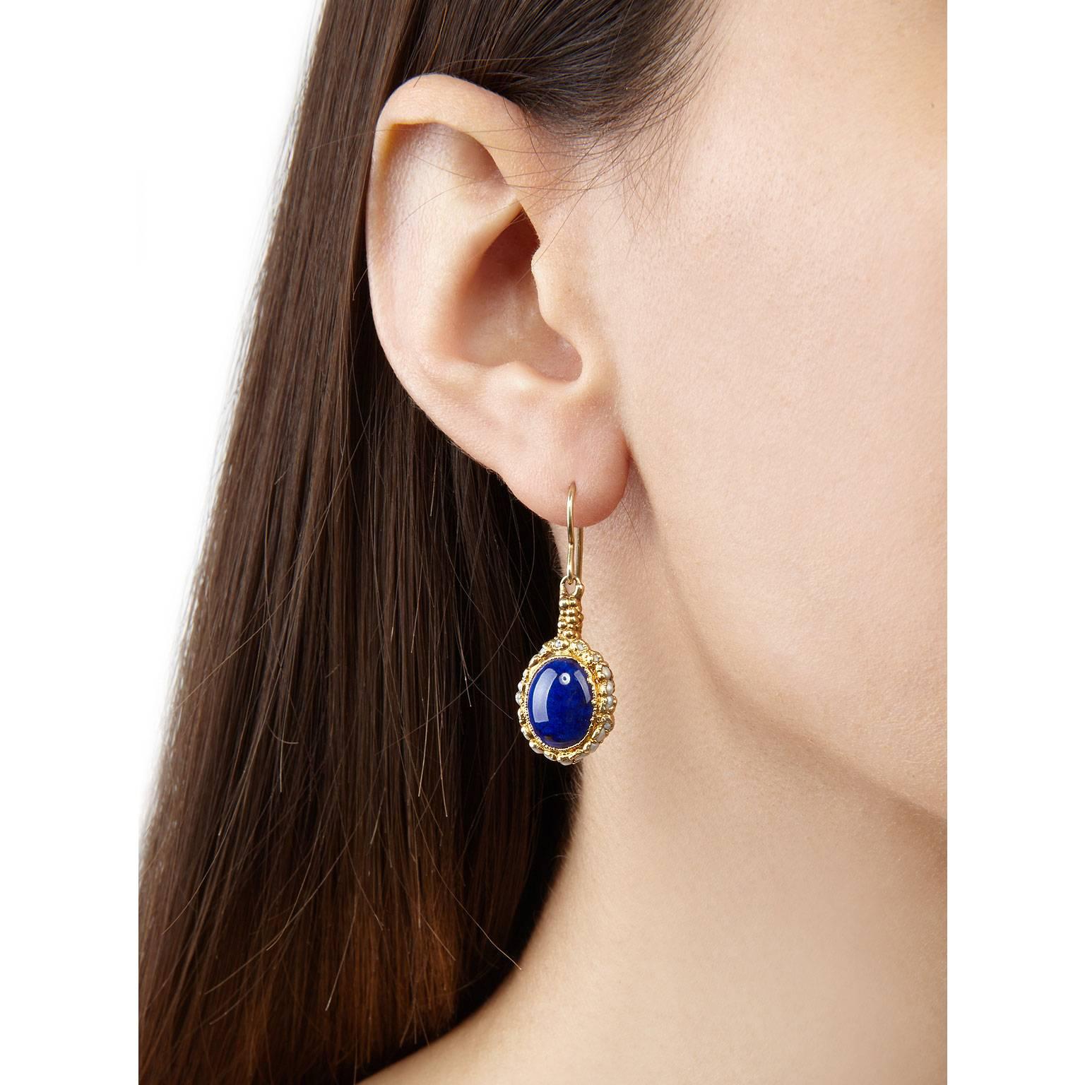 Add a little opulence to your everyday look with these understated Mary Rose earrings. Featuring midnight-blue lapis lazuli stones at their centre and surrounded by a halo of seed pearls. They are encrusted in granules of gold plated silver.