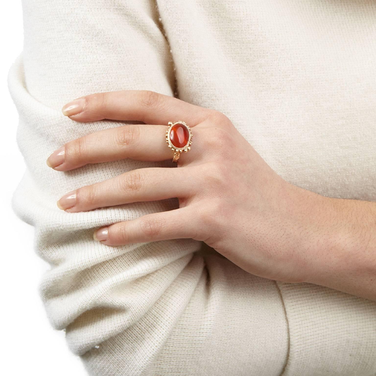 The beautiful Celeste ring displays a deep orange carnelian stone at its centre, encrusted in rose gold plated silver atop a hammered band. Bringing a little bit of daily decadence to any outfit.

Ring size: UK M / US 6.25 / EU 12.5
Stone