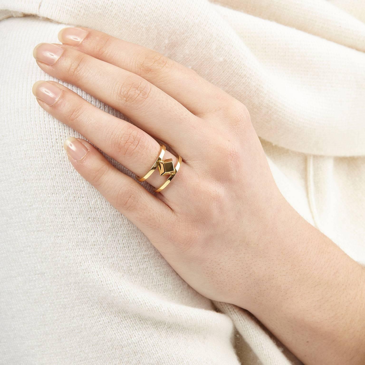 A modernist take on the cocktail ring. The simple yet bold design comprises a large pyramid set into two slender bands. Perfect for those who favour an architectural aesthetic to their jewellery.
Wear it to bring a contemporary elegance to everyday