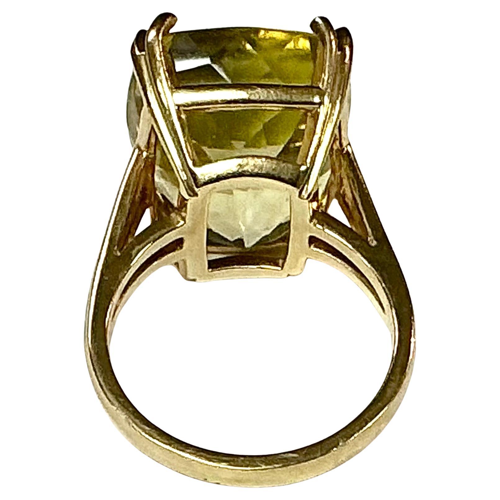 Stunning 14k Yellow Gold light green citrine ring. Approximately 10.22 Grams TW. The dimensions are approximately 10.2 mm x 15mm. Approximately 9 carats. Marked 14k. Approximate size 7.5.
