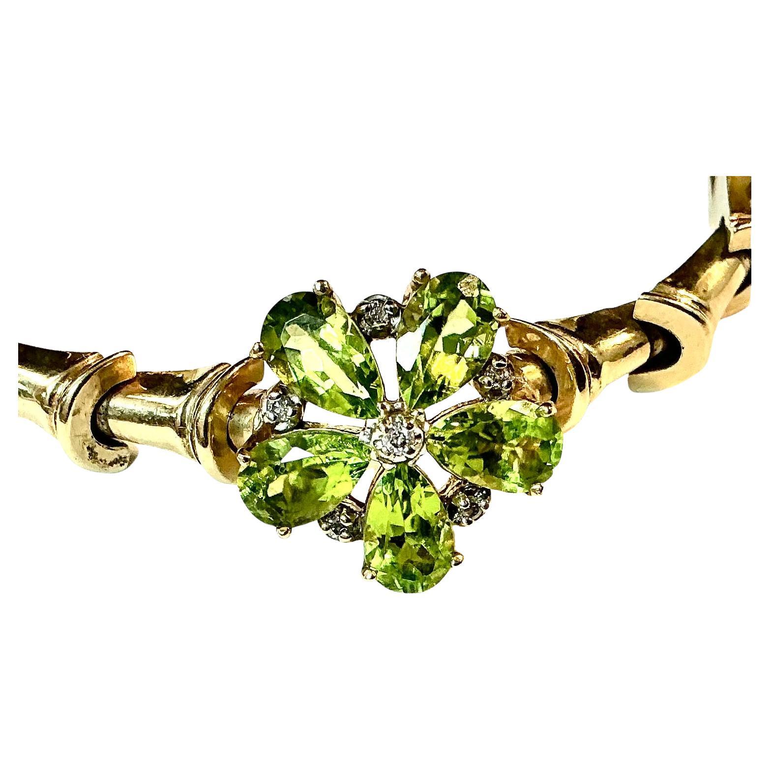 Stunning 14k yellow gold Peridot and Diamond Bracelet.  17.66 Grams TW. Each of the five peridot stones are approximately 0.5 carats for a total of 2.5 total carats. Marked 14k. Approximate diameter of bracelet is 6.5 inches 