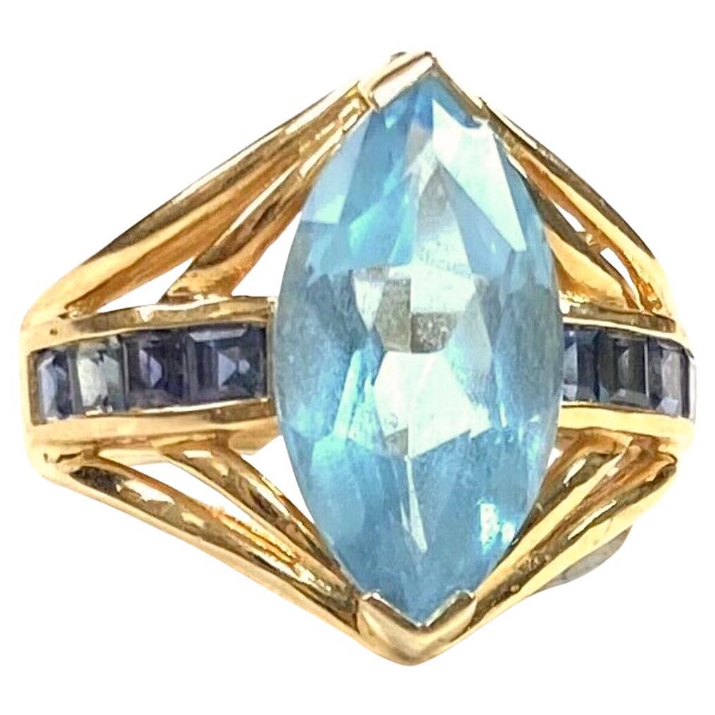 Light Blue Topaz with Dark Blue Topaz Baguettes 14K Yellow Gold Ring For Sale