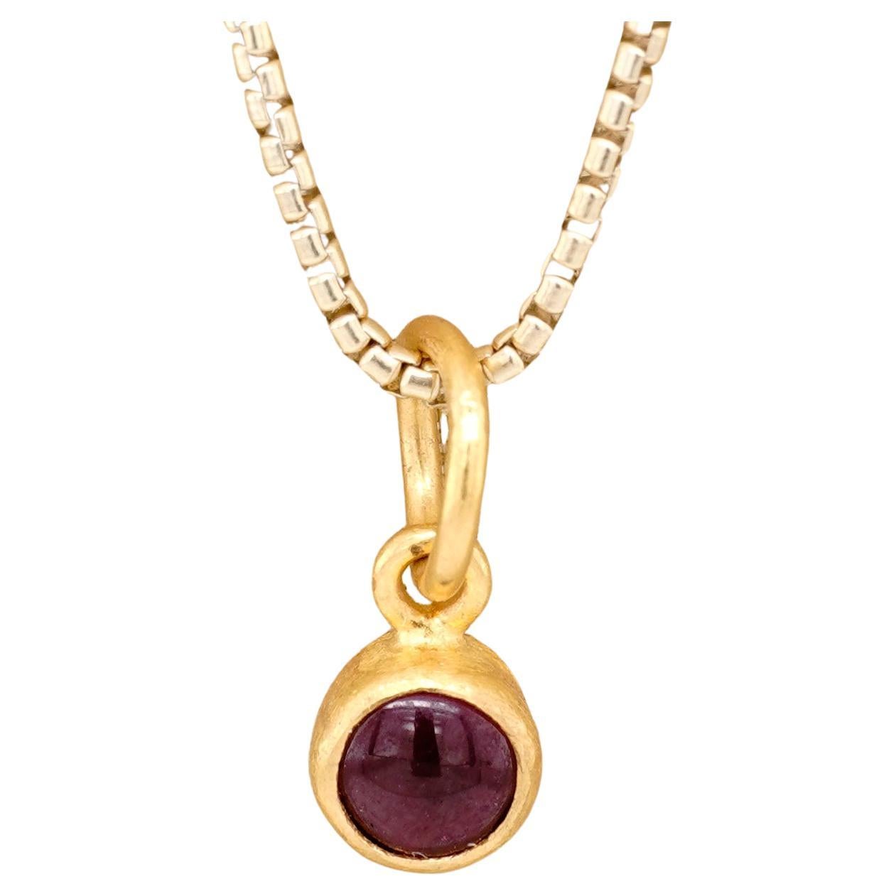 24K Gold Round, Smooth Garnet Miniature Pendant, Handmade by Prehistoric Works of Istanbul, Turkey
Garnet balances energy, bringing serenity or passion as appropriate, and can inspire love and balance the sex drive. Garnet is considered a lucky