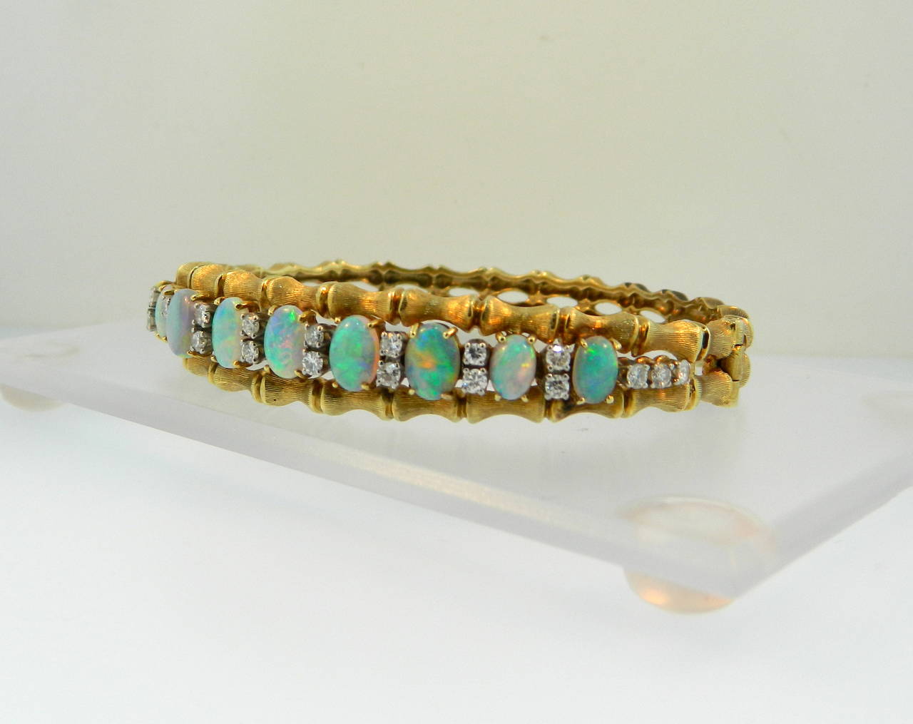 1960s opal, diamond and 14kt yellow gold bamboo style bangle bracelet.