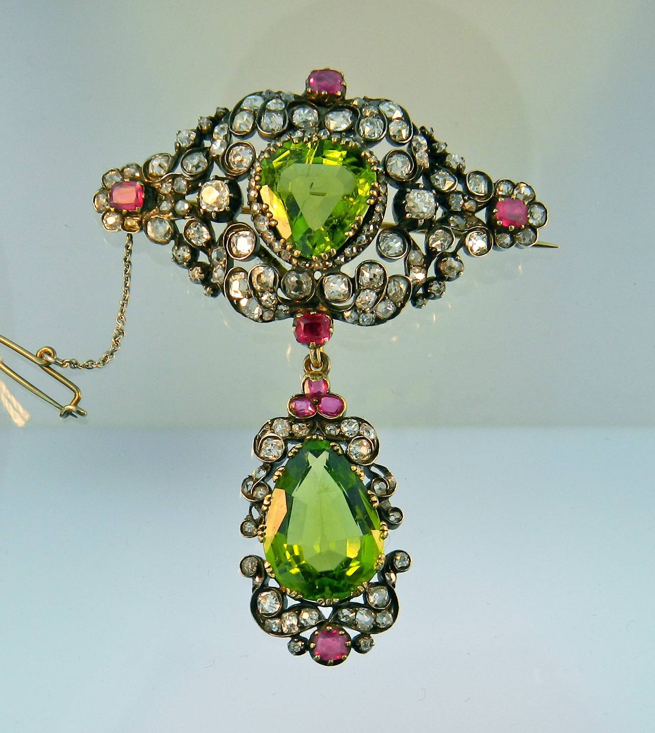 Mid Victorian Peridot Burma Ruby Diamond Corsage Brooch

Rare and superb example of Victorian 1850's jewels