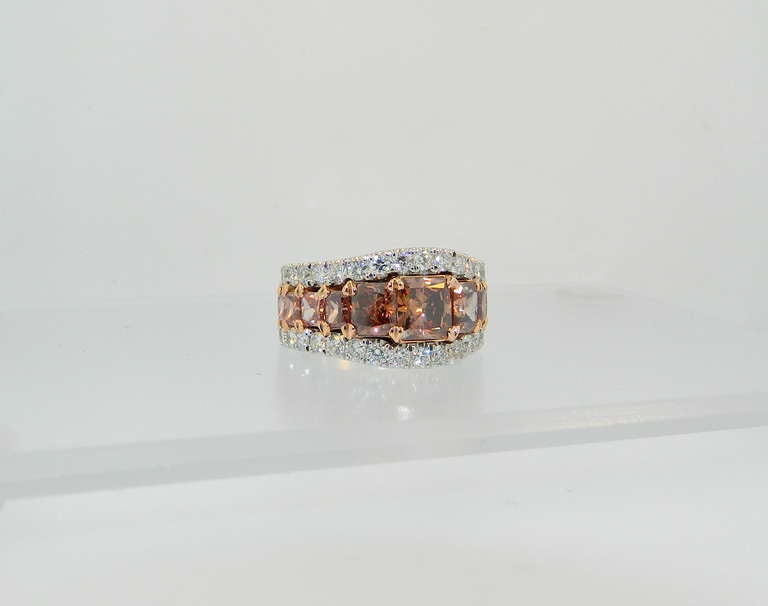 Stunning and rare, GIA Certified Natural Fancy Deep Brownish Organgy Pink, Natural Fancy Deep Brownish Pink, Natural Fancy Deep Pink-Brown, and Natural Fancy Deep Brown-Pink Diamond and platinum 3/4 Eternity band.  Each of the 13 natural Fancy