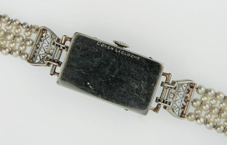 A gorgeous and rare lady's Art Deco platinum, diamond, and natural pearl wristwatch by Leon Hatot for Lacloche.