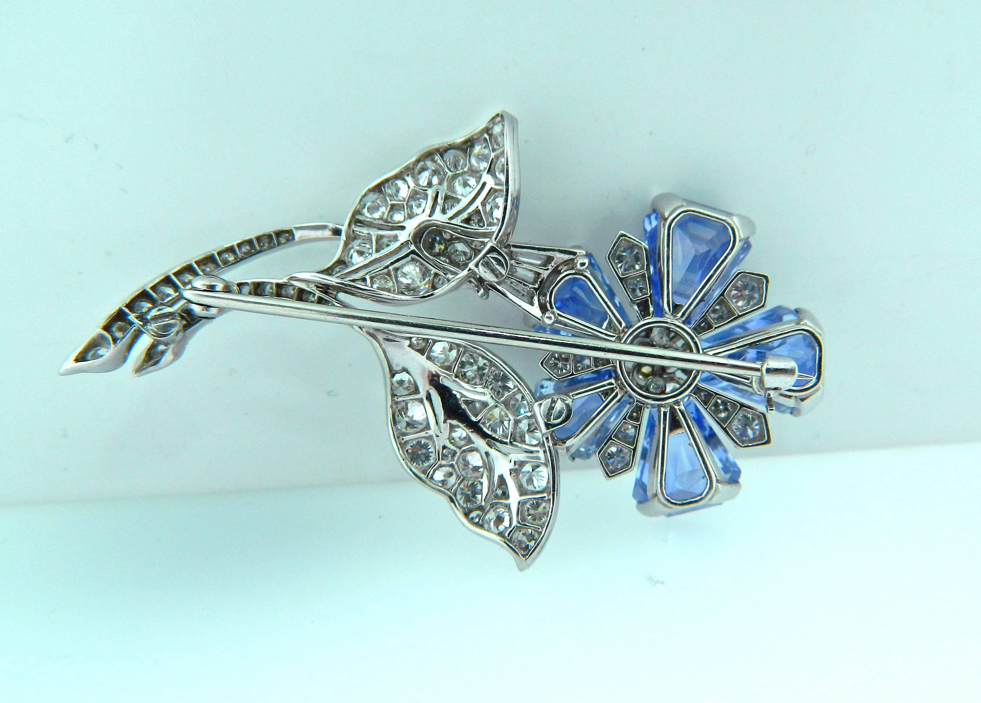 An absolutely stunning and rare sapphire, diamond and platinum floral brooch from the late art deco/early retro period.  Approximately 10 carats of fine kite shape sapphires.  Superb craftsmanship!