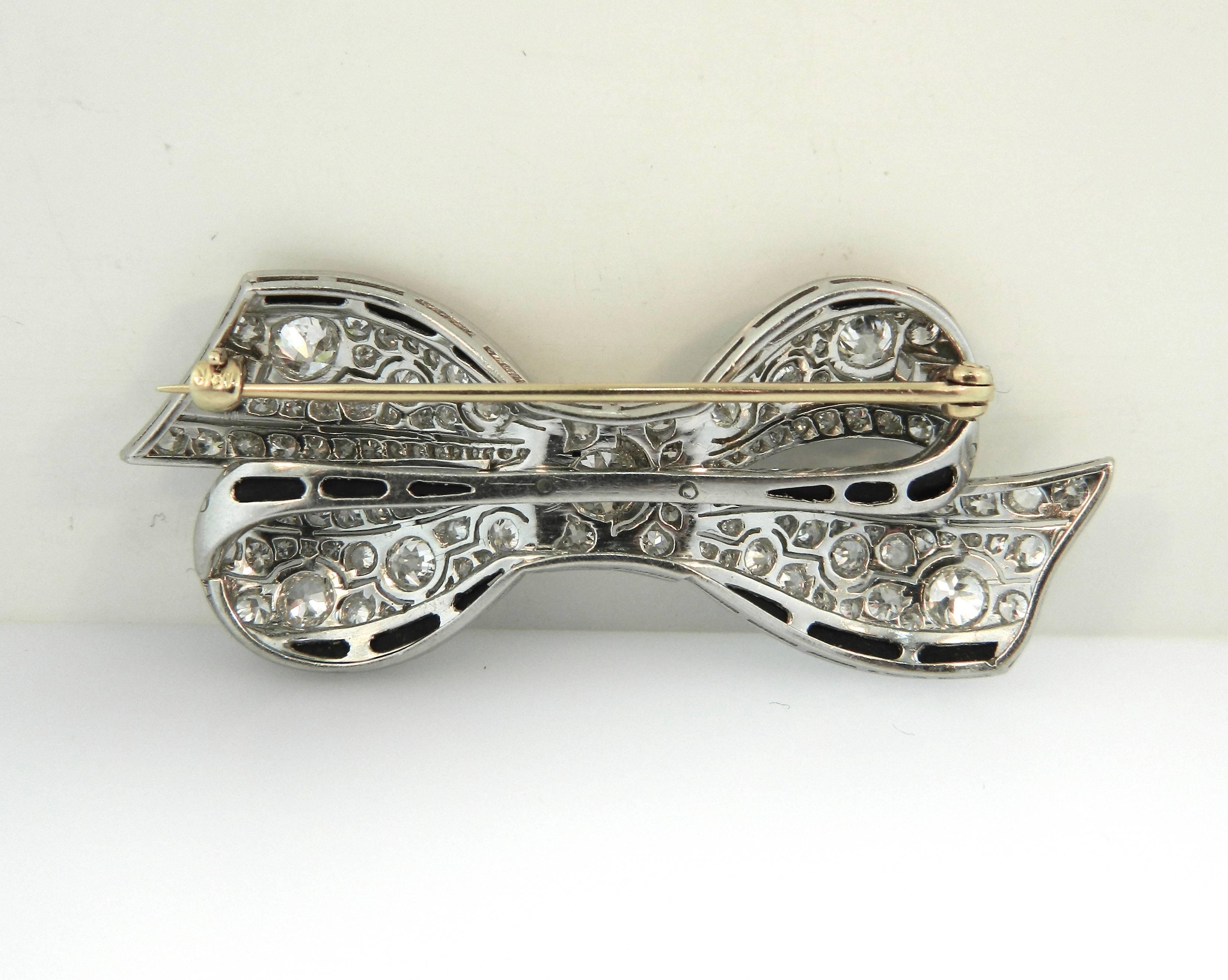 1920s Art Deco Onyx Diamond Platinum Ribbon Brooch For Sale 1