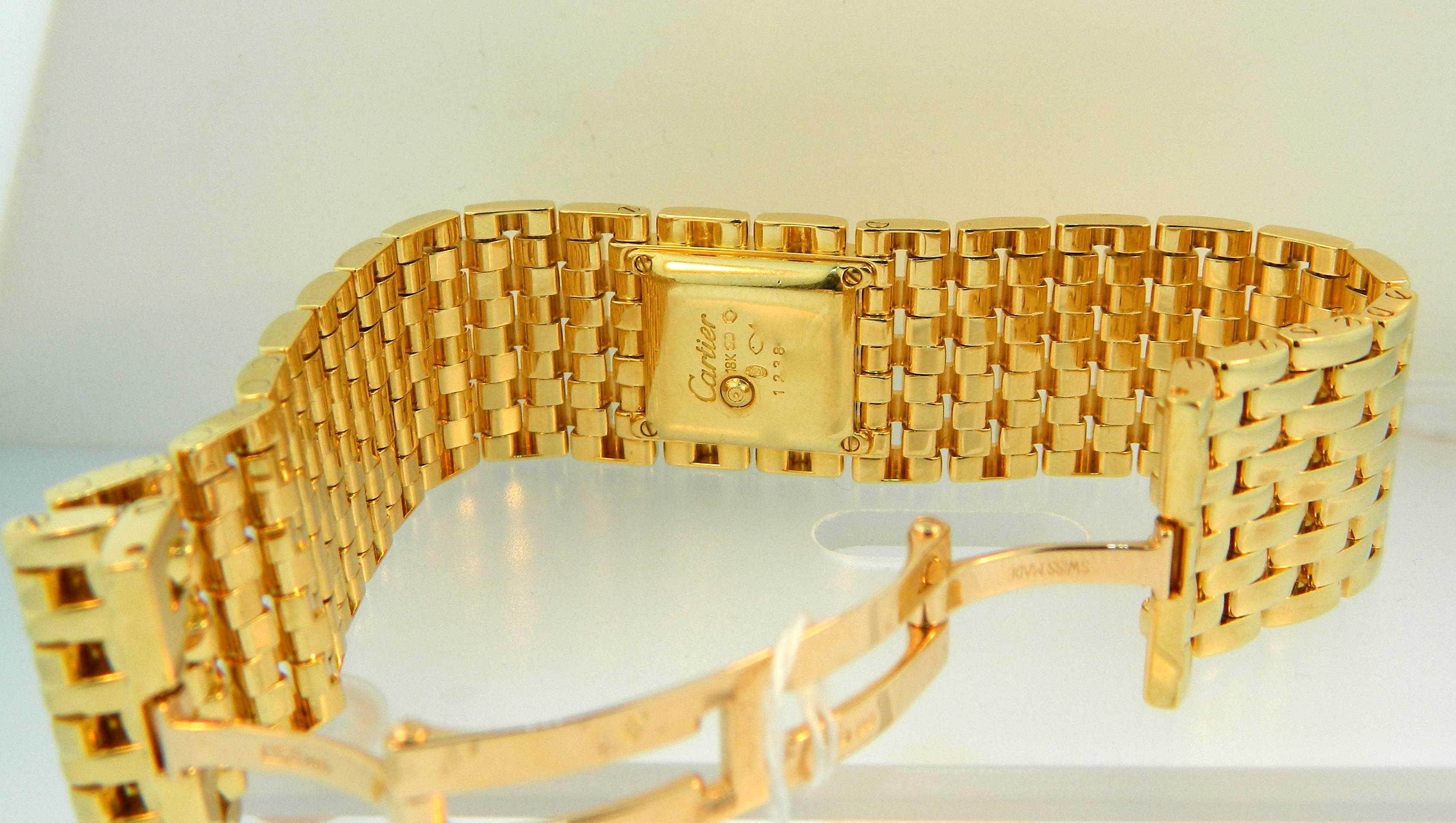 A ladies 18kt yellow gold Cartier Panthere Ruban ladies wrist watch.  Quartz Cartier movement. 
Reference  WG3007T7.  Accompanied by it's original Cartier Box.