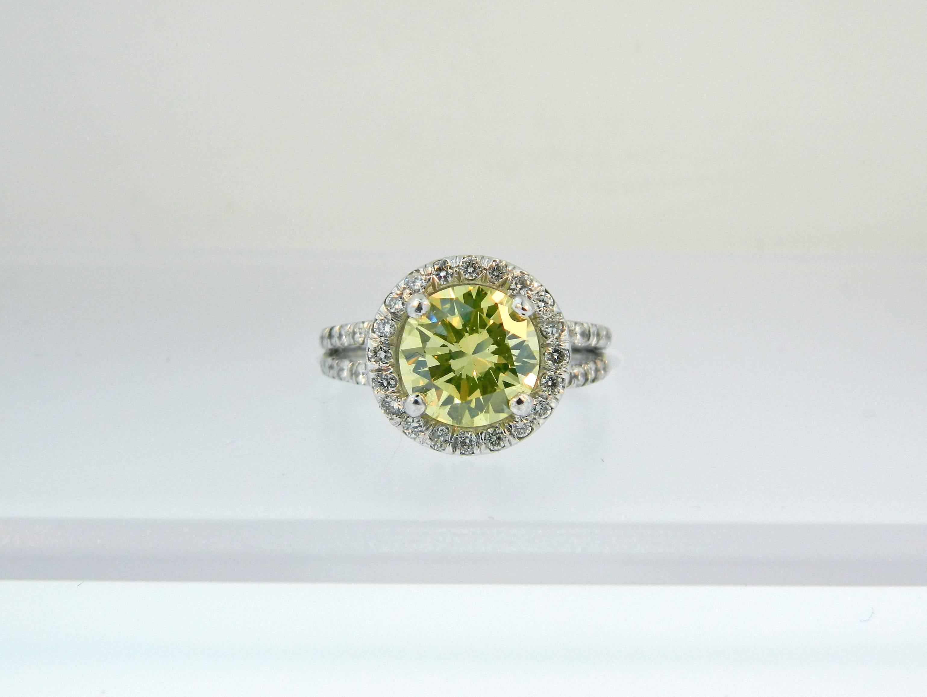 A Gorgeousand Rare GIA Certified 1.89ct Fancy Intense Greenish Yellow VS2 Diamond and Platinum Halo Ring