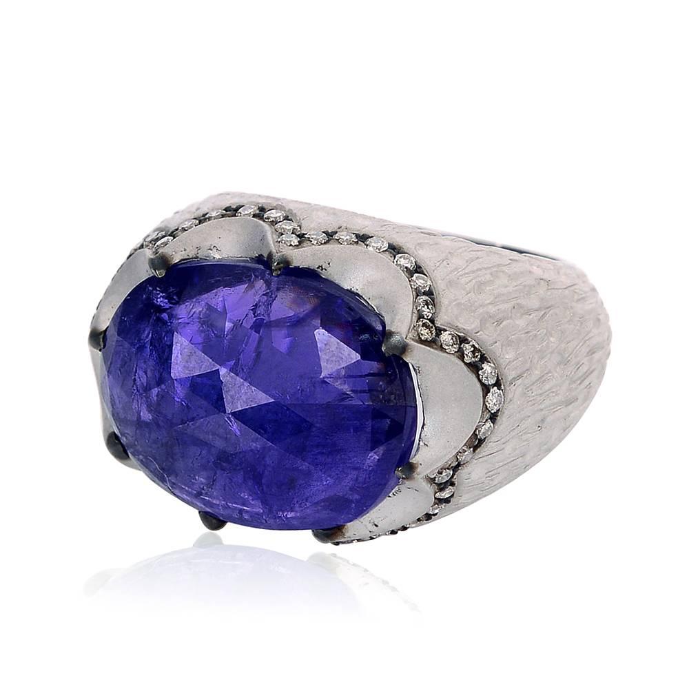 Stunning 18K White Gold Tanzanite Ring with Diamonds handmade and hand etched for the texture. The tanzanite is set east to west and is surely an eye catching piece.

Ring Size: 8 (can be sized)

14k:11.39g
Diamond: 0.48ct
Tanzanite: 14.21ct
