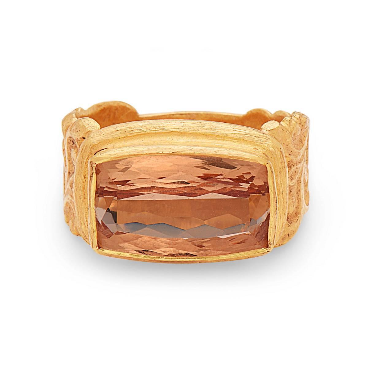 Perfectly cut and handcrafted barrel shape precious topaz cocktail ring in 22K yellow gold with a beautifully carved shank.

Ring Size : 7 ( Can be sized )
22kt: 10.13gm
Precious Topaz: 5.85cts

