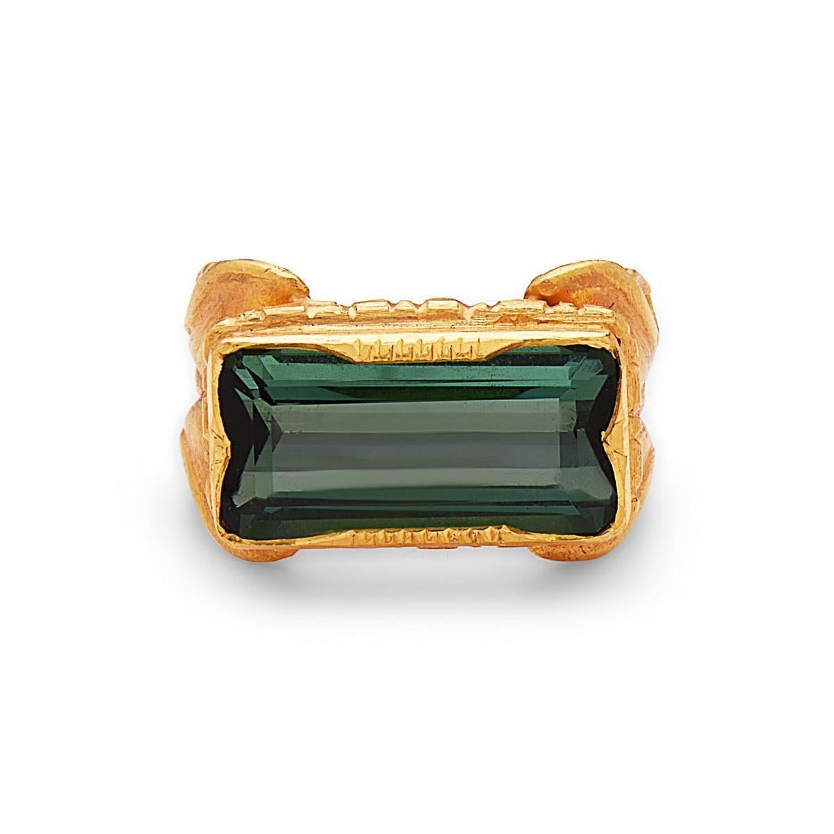 Beautiful handcrafted long green tourmaline baguette ring with a floral shank in 22k Yellow Gold.

Ring Size: 7 ( Can be sized ) 

22kt:10.75gms
Green Tourmaline: 8.67cts
