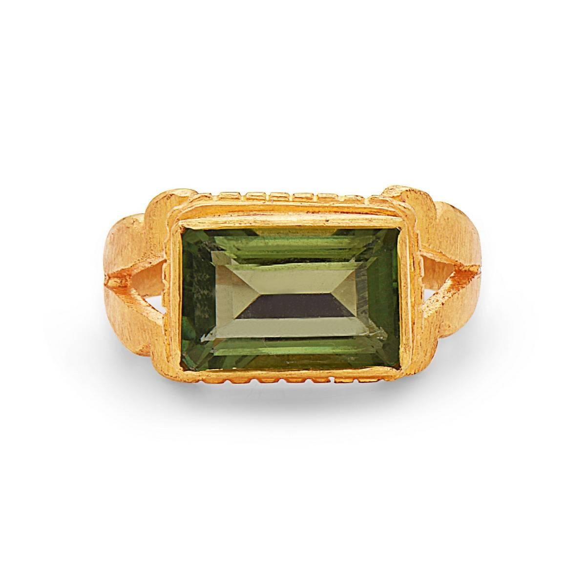 Eternal looking Green Tourmaline Ring in 22K Gold handcrafted by our finest artisans is a beautiful piece to own.

Ring Size: 7.5 ( can be sized )

22kt: 8.59gm
Green Tourmaline: 5.10cts 