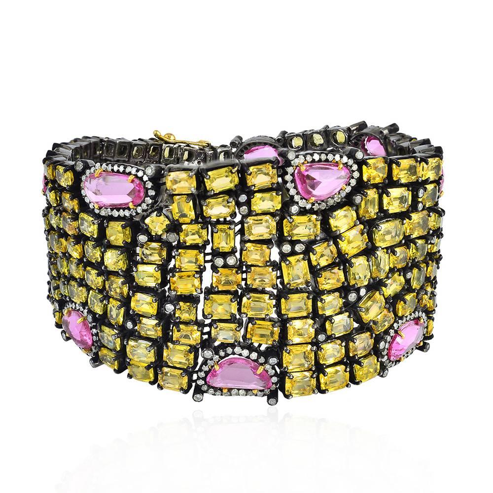 Super luxurious looking and rare Yellow and Pink Sapphire Bracelet is 7 inch long and is super flexible. This bracelet has a tongue clasp with safety locks on both the sides.

14K:5.51g
Diamond:2.59cts
Silve:46.97gms
Sapphire:65.19cts
