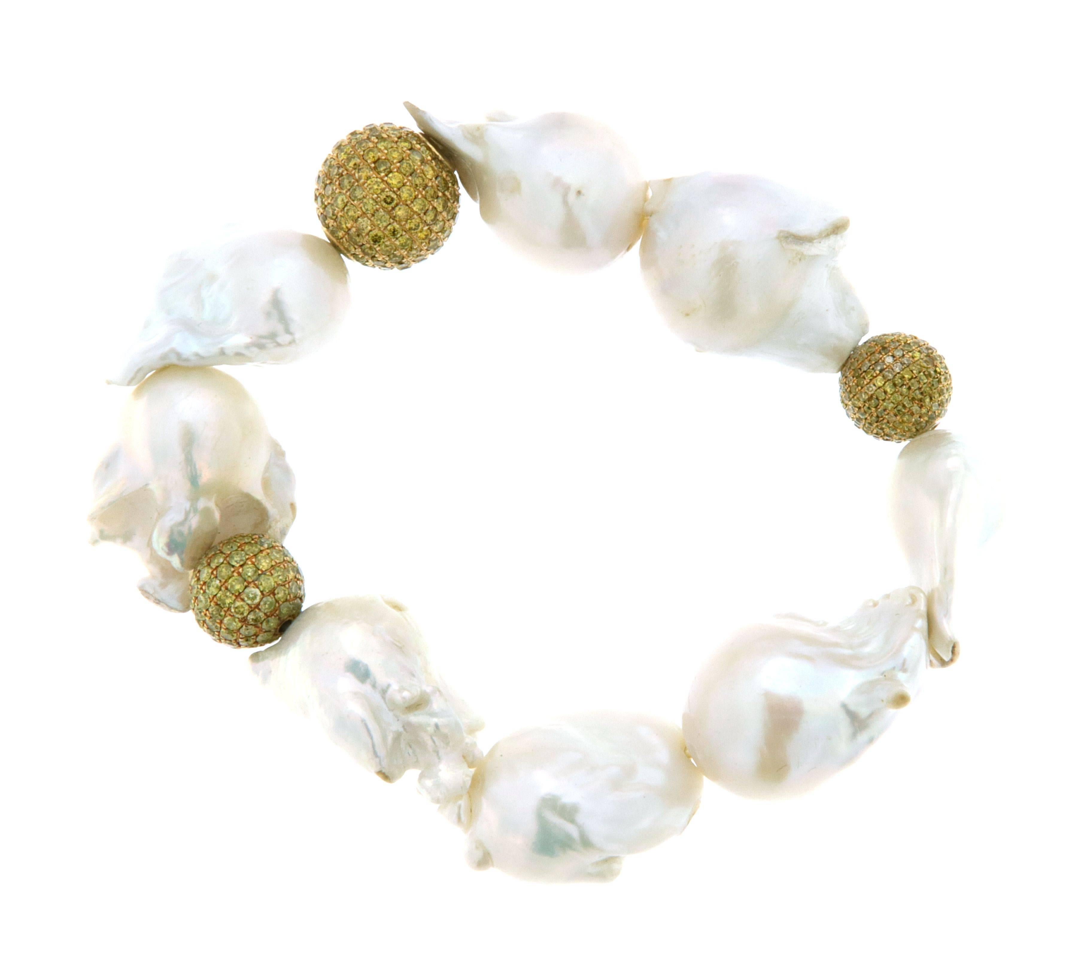 Feel the breeze of ocean and sunshine in you hand with this beautiful hand knotted stretchable bracelet.
  

18kt:8.05gms
Diamond: 6.75cts
Fresh Water Pearl: 236.45cts