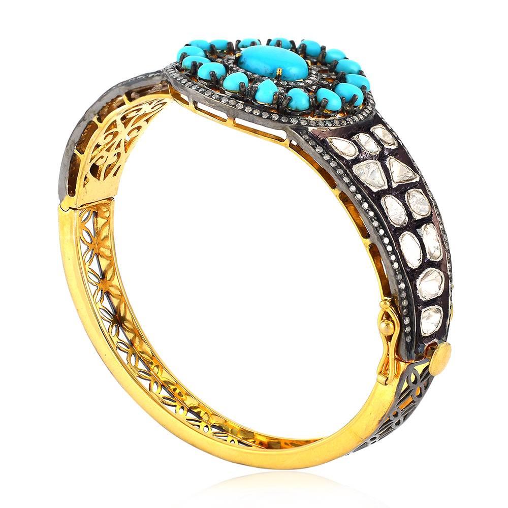 This beautiful victorian looking rosecut diamond and Turquoise center design openable bangle bracelet is a must have for this summer.

18KT GOLD: 2.106G
Diamond: 4.669CT
SI: 26.856G
TURQUOISE: 4.41cts