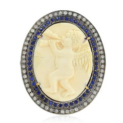 Cameo Cupid Ring Diamonds and Blue Sapphire