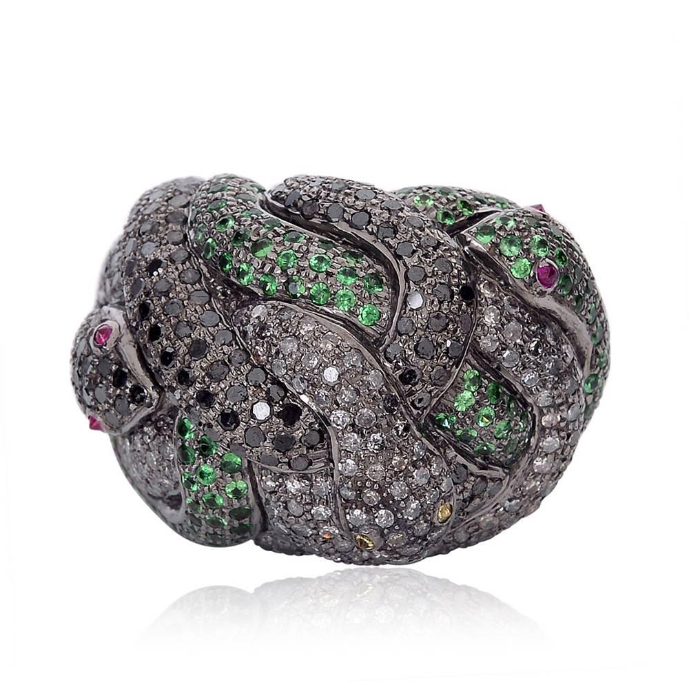 This designer snake ring with Diamonds and Tsavorite is a for snake lovers tottaly a cocktail ring.

Ring Size: 7 ( can be sized )
D:3.57ct,
Silver: 21.73gm
Tsavorite: 1.71ct