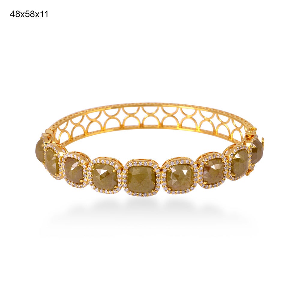 Stunning 18K yellow gold bracelet bangle beautifully encrusted with Yellow Ice diamond and pavé diamonds totaling to 202 diamonds weighing to 17.78cts of I2 quality. The hinge has a safety clasp to keep the fastening secure. Fits to wrist size