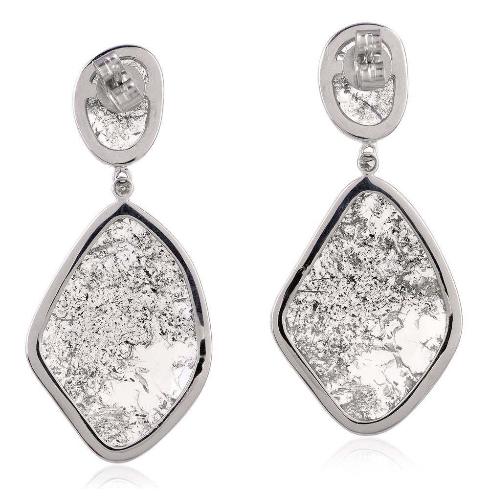 These Diamond Slice earrings are  beautiful, entirely handmade and one of a kind. Set in 18K white gold, this pair has total of 10.44cts of glistening slice and pavé diamonds and has a lightweight drop. Sweep hair to the side to showcase them for