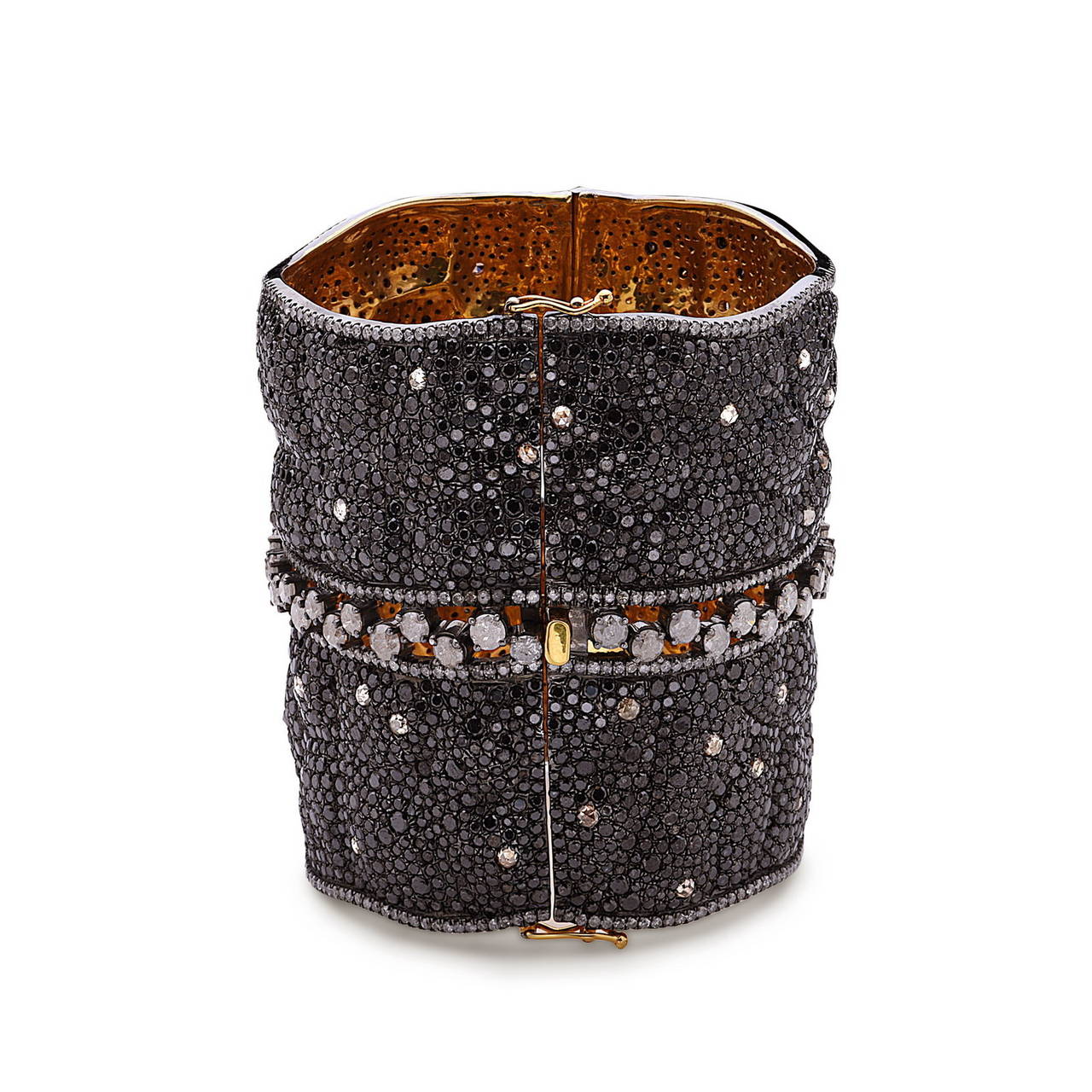 18K Gold & Silver this Bodacious Bangle is studded with Black & White Diamonds. This bangle narrows down on your wrist and is openable to put on very easily with safety clasp. Goes perfect with any evening gown. Total diamond weight is