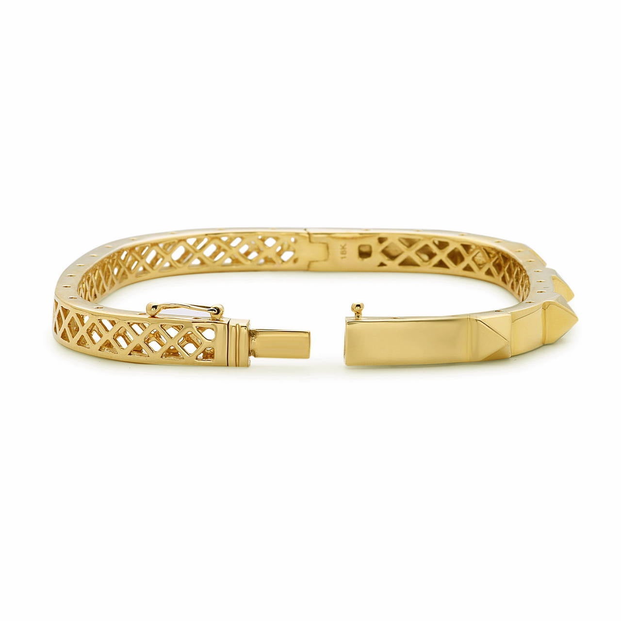 18K Cushion Shaped Spike Yellow Gold Bangle is openable and very comfortable and to wear. It has a very intricate gold work on the back side of the bangle. Gold weight: 23.16gms 18K. Wrist size: 2.2x1.4 inches.