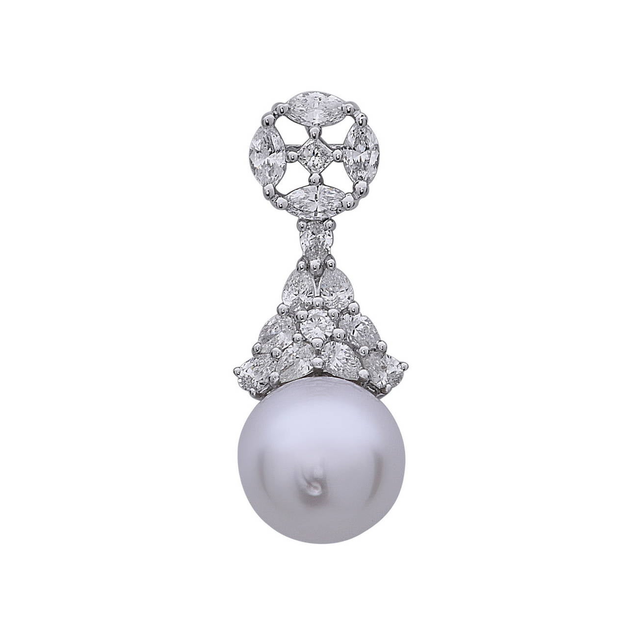 This alluring 18K White Gold set with Diamond & South Sea Pearl can make you the star of the evening. Yes, we do have matching necklace to go with this. 
Diamond weight: 2.66cts, Quality: G color S1 
Pearl: South Sea Cultured 12mm