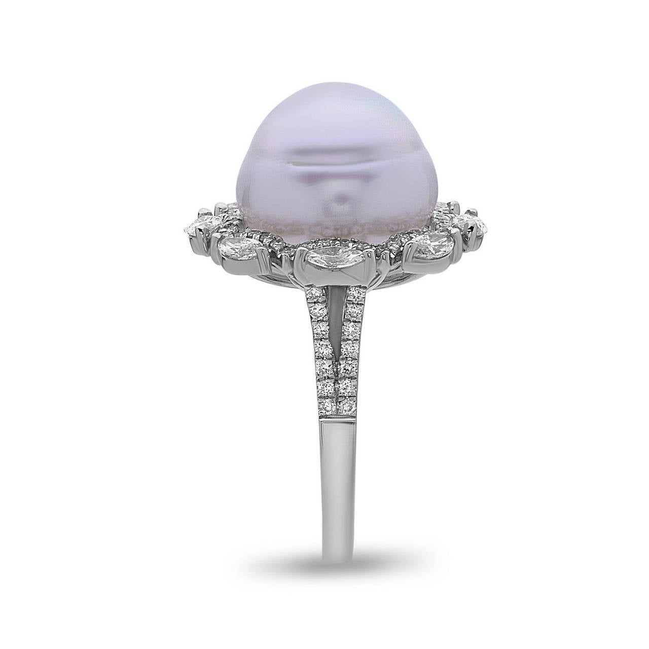This beautiful diamond & South Sea Pearl Ring is set in 18K White Gold. The octagon shape around pearl is very unique with marquee & round shape diamond. This ring is size 7.25 but can be sized as you please. 
Diamond weight: 1.28cts, Quality: G