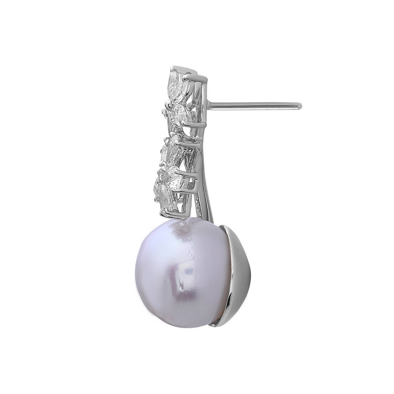This Stunning Floral Diamond & South Sea Pearl Earring  is made in 18K White Gold with marquee, pear, round diamond & South Sea Pearl. The ear closure is push post. We provide GCAL certificate with this item.

Diamond weight: 2.48cts, Quality: G