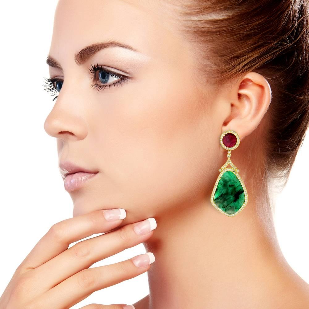 Elegant and Very attractive 18K Yellow Gold Ruby Emerald  Quartz Earring studded with pave diamonds around. Wear it to be noticed again and again with a black and gold shimmer dress.
Emerald: 34.95cts
Ruby: 5.05cts
Diamond: 3.04cts
Earring