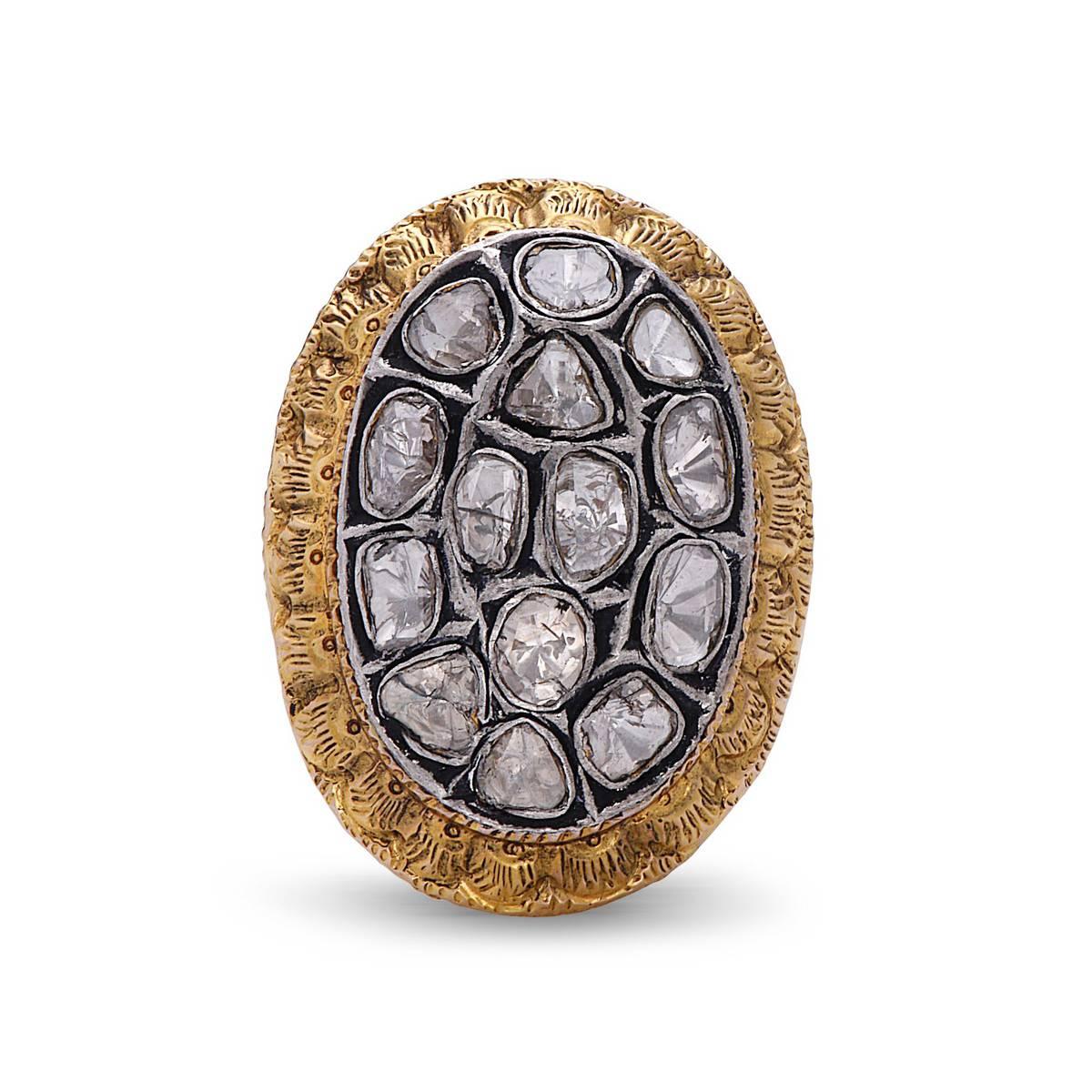Feel like a princess when you put this gorgeous oval shape vintage looking 14K gold & silver ring with beautiful embossed gold work around diamonds and on the shank. 

Ring size: 6.75 (can be sized) 
14k Gold: 9.05gms 
D:1.29cts
               