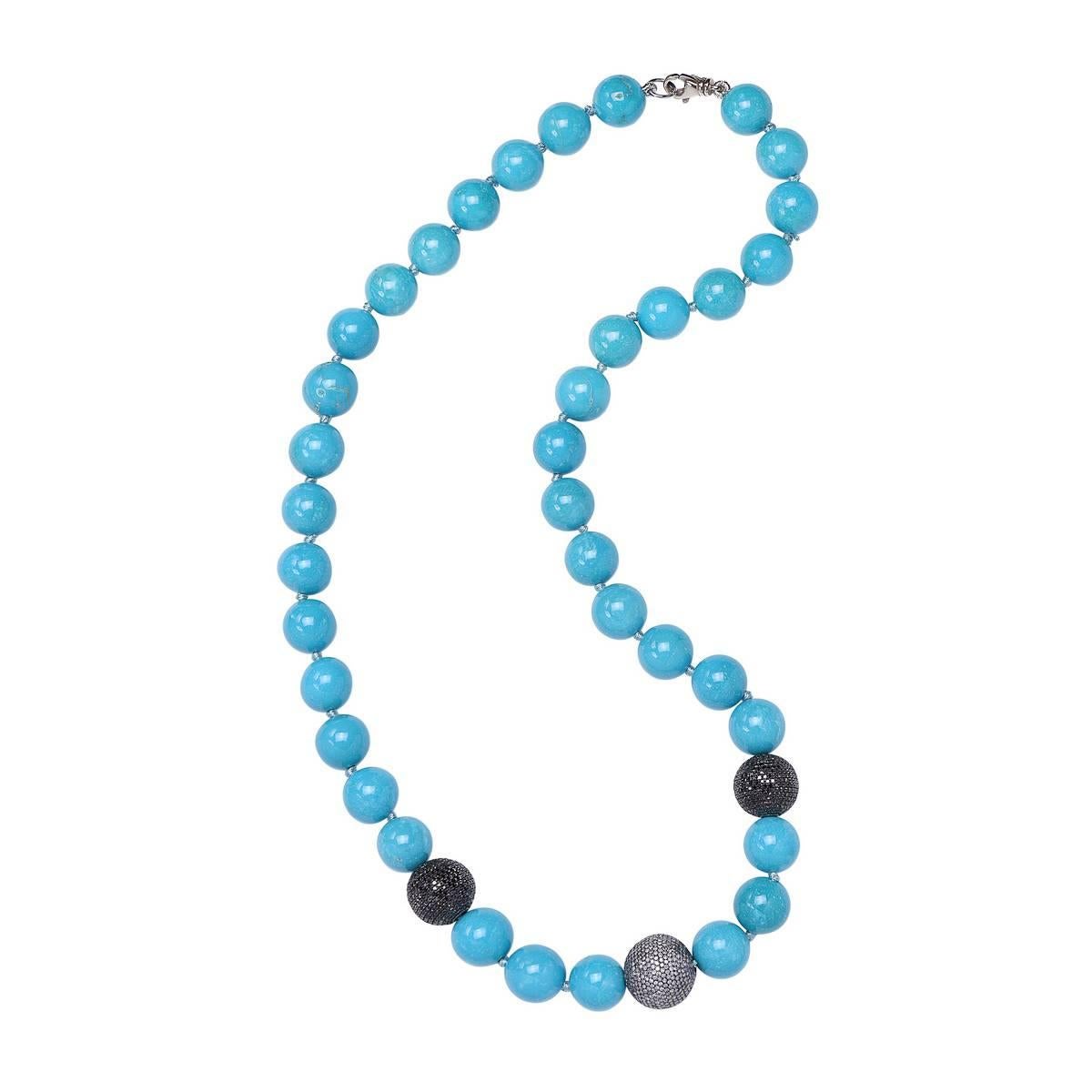 Perfect for a winter and a summer party this very charming beaded Turquoise Necklace with center Champagne diamond Ball & 2 black diamond Balls hand knotted. This necklace is openable with a lobster clasp. 

18kt:15.21gms
Diamond:11.01cts        