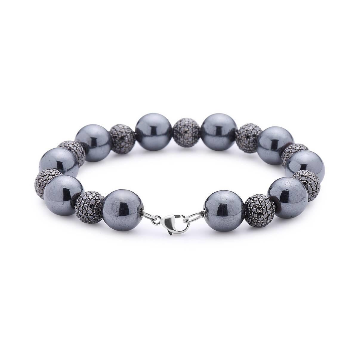 Chic Tennis Black Diamond Ball Bracelet is an excellent piece to match any of your black outfit. It is 7 inch long but the size can be adjusted if requested. The balls are 8mm diamonds with alternate 10mm hematite passing through 14K white gold
