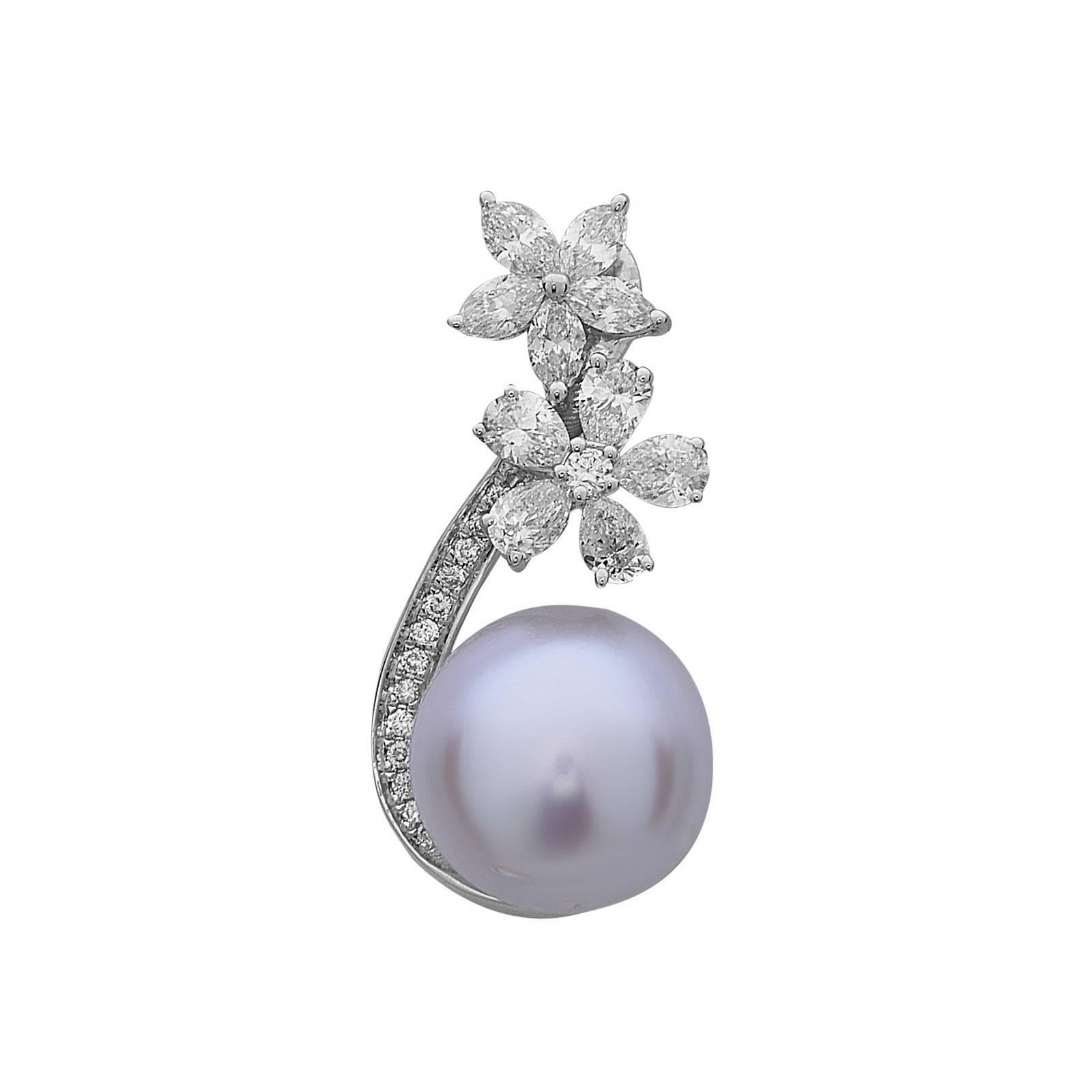 Stunning Floral 18K White Gold Pearl and Diamond Earring is super rich looking. It has 2 flowers one made on pear shape diamonds and another of marquees with a swirl of pave diamonds.

Earring Closure: Push Post
18k :8.42gms
Diamond: 2.48cts