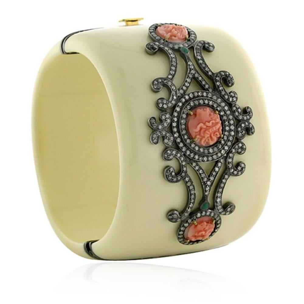 Beautiful White Bakelite Cuff with Face Cameo Coral & artistically set Pave Diamonds. Wear this antique looking cuff from work to wine. This is and openable bangle with a tongue clasp.  