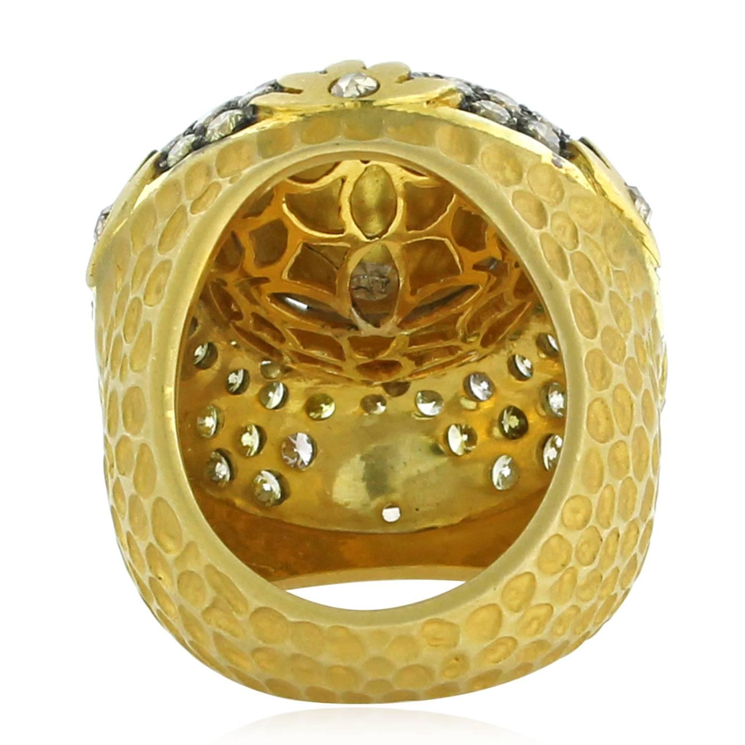 Bold and Royal Looking Rosecut Diamond Ring in 18K Yellow Gold. With floral design on the sides and bright yellow pave diamonds around the big rose cut diamond and texture on the shank this is a perfect cocktail ring. 

18k: 24.32gms
Diamond: