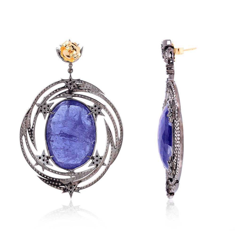 Feel the starburst with this earring set in silver with gold push and post. Center stone is Tanzanite with stars going around set with diamonds

18kt:0.52gms
Diamond: 6.62Cts
Slv:24.076gms
TANZANITE: 69.00cts

