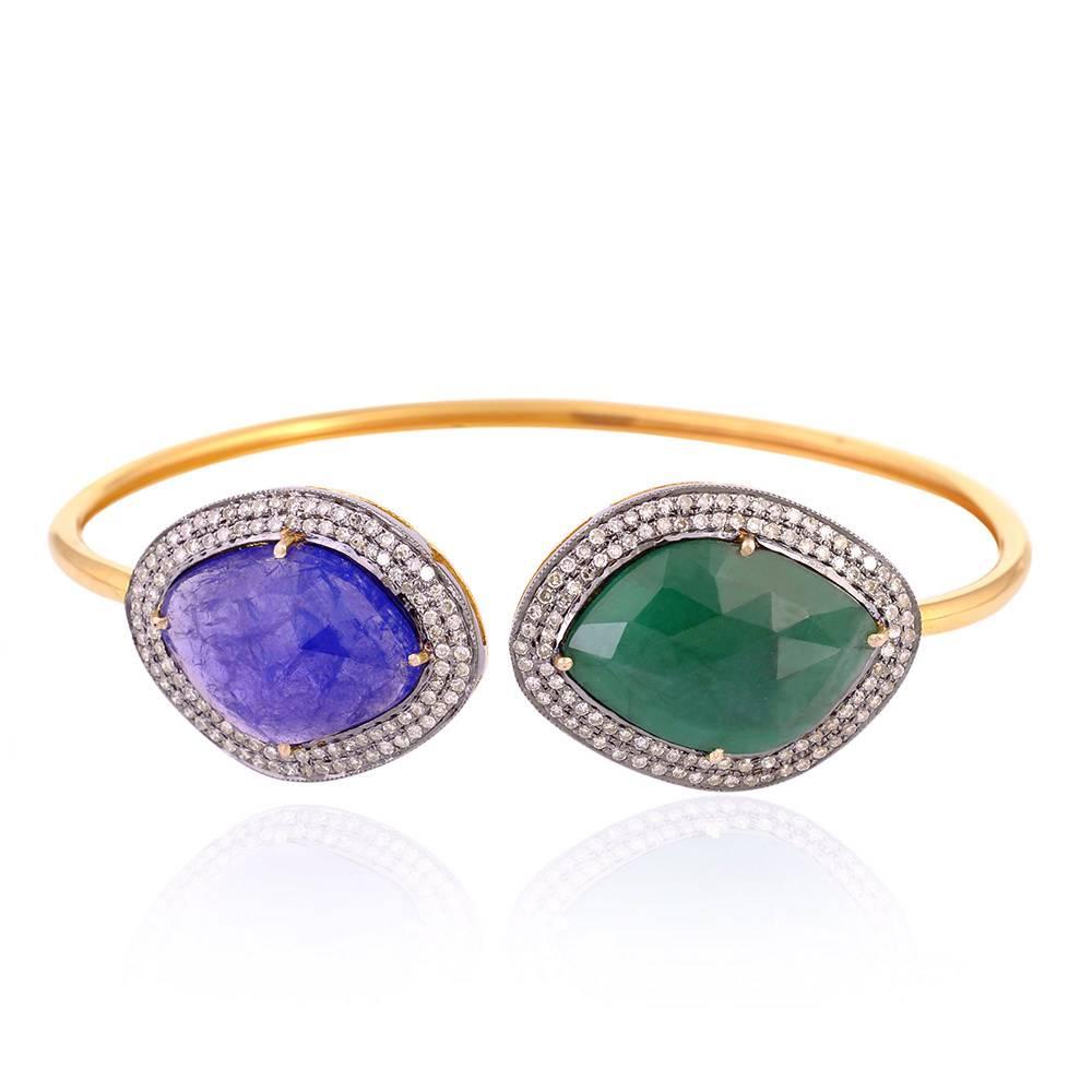 Open on top and twist-able this sliced Tanzanite and Emerald Bangle with diamond accent around is piece you can wear this summer the most and anytime of the day will make you look chic.

14kt:5.62gms
Diamond: 0.95cts
Slv:2.796gms
Emerald: