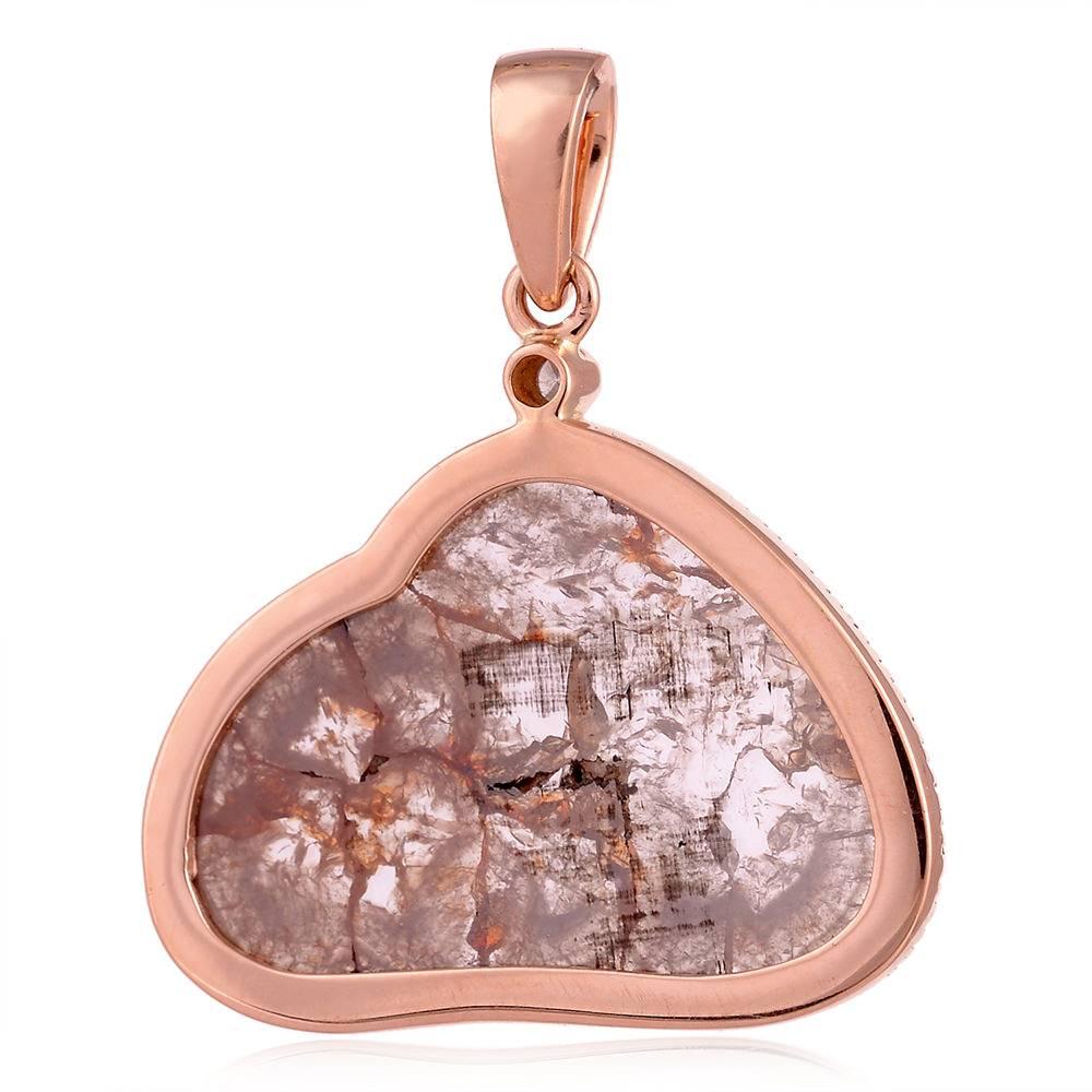 Divine Pinkish Sliced Diamond Pendant in Rose Gold with pave around is really stylish and something to beautiful to wear with your off shoulder tops and dresses this season. There is no chain included with this pendant..

18kt:3.9gms
Diamond:3.9cts,