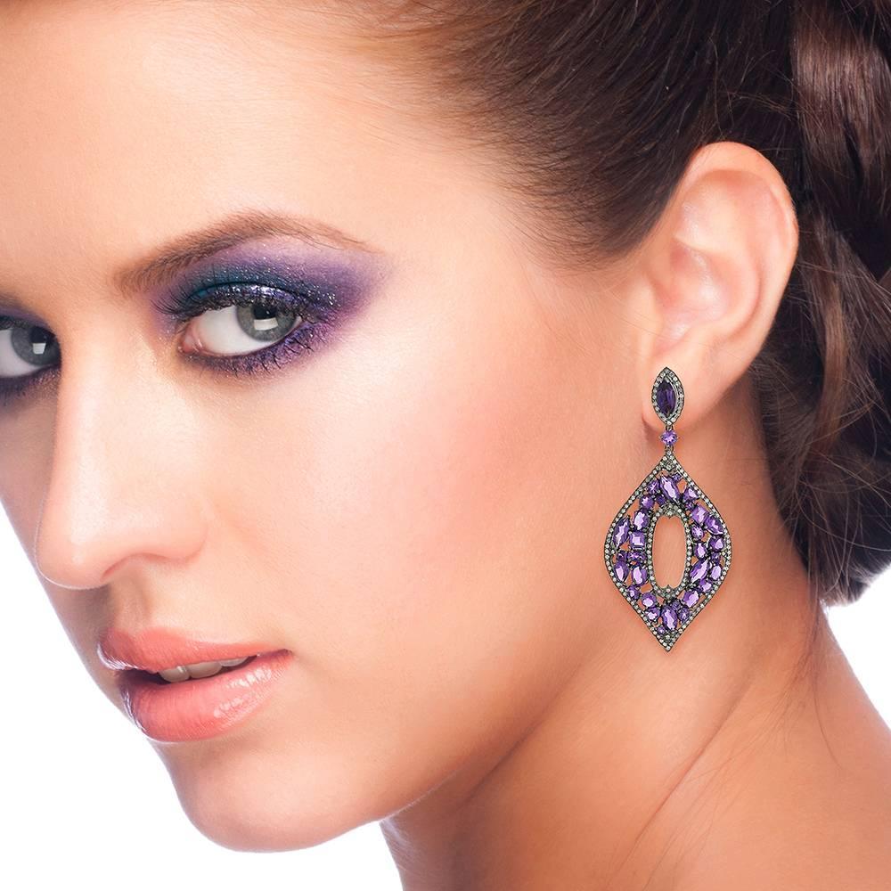 This earring is very unique and pretty with different shapes of Amethyst set in a pretty leaf shape with pave diamonds around. 
Closure: Push Post

18k: 1.37g
Diamond: 2.37ct
Amethyst: 17.05cts