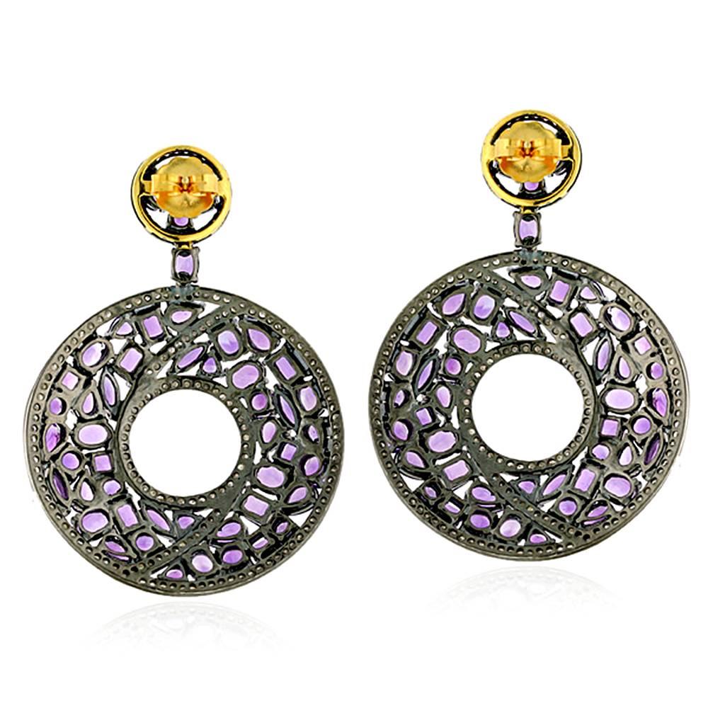 This donut shape Mosaic patterned Amethyst and Diamond Earring is a very attractive and fashionable earring in our stock.

Earring Closure: Push Post

18k:2.8g
Diamond:2.93ct
Slv:34.87gm
Amethyst:30.28ct   